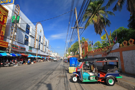 KORAT-APR 28  Motor tricycle called Tuk Tuk parking opposite local fresh market in Nakhon Ratchasima, aka Korat, Thailand on April 28, 2013  Tuk Tuk is used for transit around Korat downtown のeditorial素材