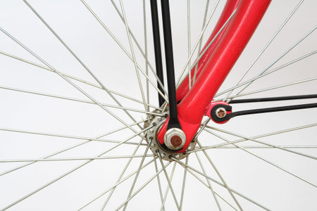 Closeup of bicycle spoke on the wheel isolated on white  の写真素材