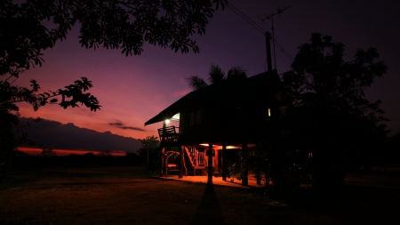 twilight sky with silhouette house at the rural, Thailandの写真素材
