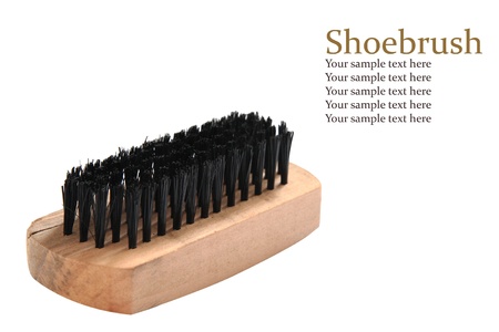 Wooden shoe brush and black bristles with sample text  isolated on white の写真素材