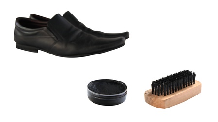 Black polish and wooden shoe brush to clean black leather shoes isolated on whiteの写真素材
