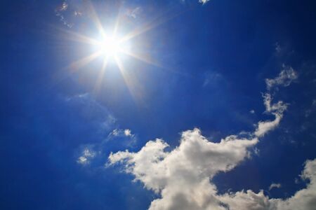 Strong sun and beautiful clouds at skyの写真素材