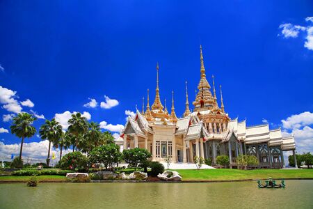 Thai temple named Wat Sorapong near the pond against blue sky in  Nakhon Ratchasima or Korat, Thailandの写真素材