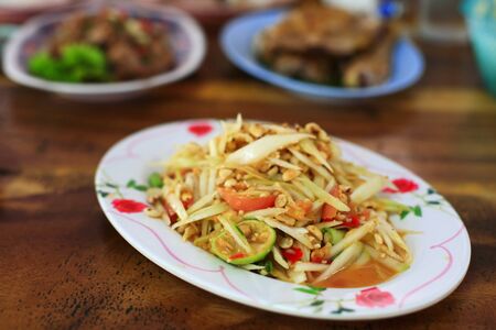 SomTum, Thai Green Papaya Salad on wooden tableの写真素材