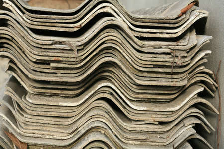 stack of old used sheet tile roof の写真素材