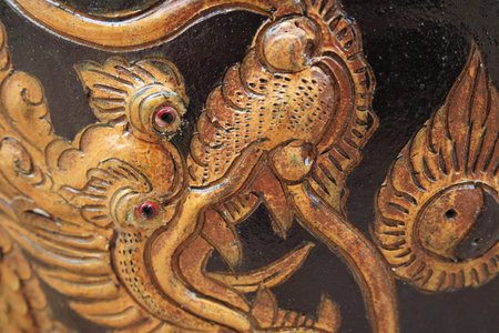 chinese golden dragon stone craving on wallの写真素材