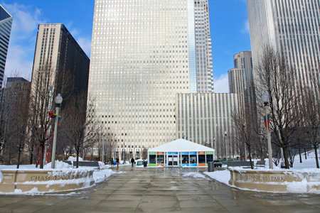 CHICAGO,IL-FEB 09  Unidentified people visit Millenium park, constructed on 1998 and opened on 2004, against high building towers at winter on February 09, 2008 in Chicago, IL USA のeditorial素材