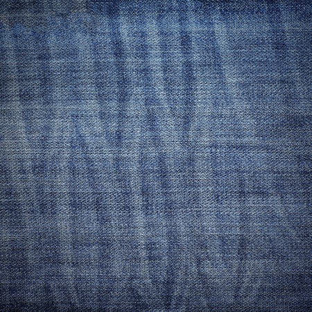 Textured pattern of pale blue jeansの写真素材