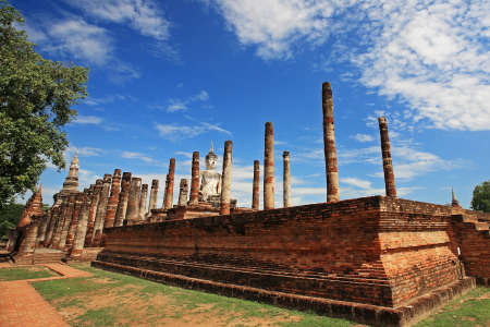 Sukhothai historical park landmark- wat Mahathat  against blue sky, Thailandの写真素材