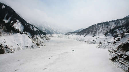 Kurobe alpine covering by snow at winter in Tateyama, Japanの写真素材