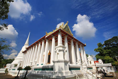 Temple and pagoda against blue sky at wat Chalerm Prakiat in Nonthaburi, Thailandの写真素材