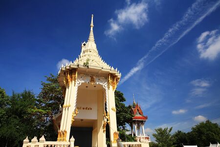 Traditional Thai crematory or pyre against blue skyの写真素材