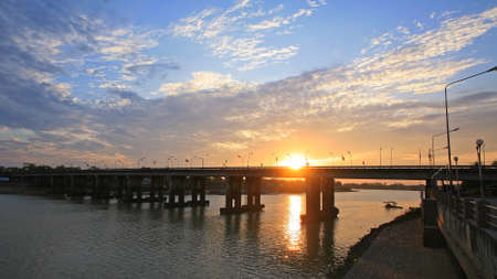 Bridge across river at sunset and twilight sky, Thailandの写真素材