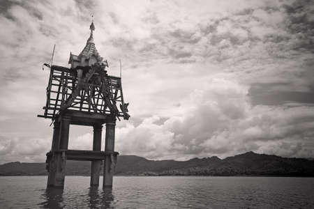 Small pagoda in the river at Sangklaburi, Kanchanaburi, Thailandの写真素材