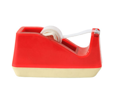 Red plastic tape dispenser isolated on whiteの写真素材