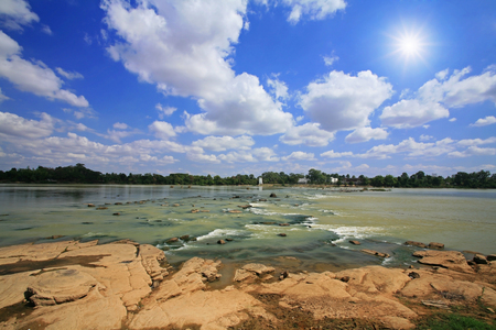 Mool river against sun beam and blue sky at Kang Sapue in Ubon Ratchathani province, Thailandの写真素材