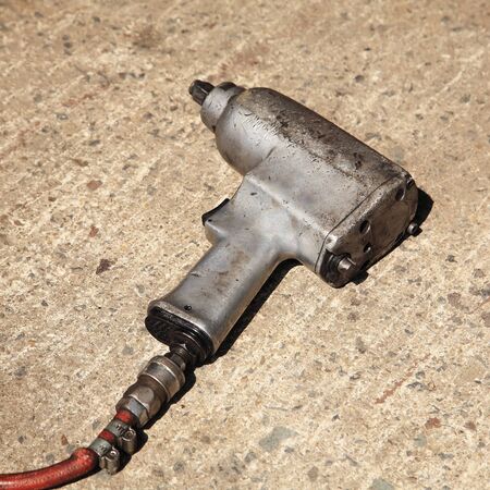 pneumatic wrench mechanic tool on floorの写真素材