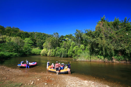 Rafters in a inflatable raft to oar along the river in Tak province, Thailandのeditorial素材