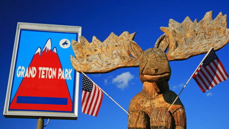 Moose statue with USA flags at Grand Teton park sign in northwestern Wyoming, USAのeditorial素材