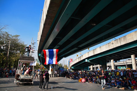 BANGKOK-JAN 13:Unidentified Thai protestors at Ladprao junction to anti government and ask to reform before election with 'Shutdown Bangkok concept' on Jan 13, 2014 in Bangkok, Thailand.のeditorial素材
