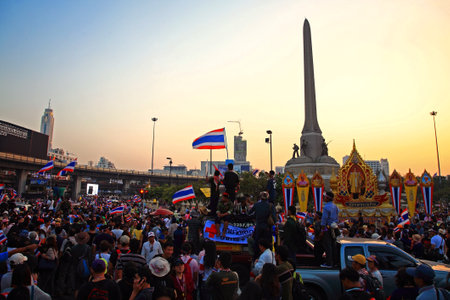 BANGKOK-DEC 22: Thai protesters gather at Victory monument during twilight sky on December 22, 2013 in Bangkok, Thailand. About 6 million Thai protesters gather in many Bangkok areas today.のeditorial素材