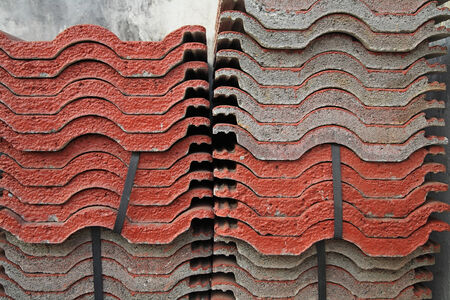 Stack of red tiles prepared for constructionの写真素材