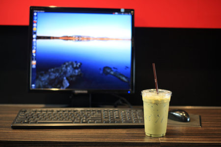 Ice milk Green tea with Desktop computer for relax