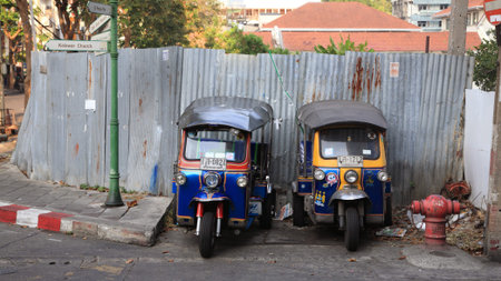 BANGKOK, THAILAND - MARCH 8,2014: Tuk-tuk moto taxi parking on the street to wait passengers. Famous...