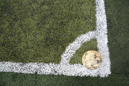 Old ball on new soccer ground at conner spotの写真素材