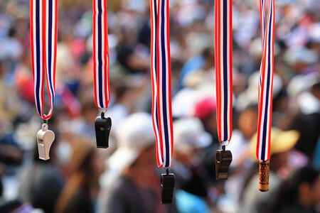 Whistles with Thailand  flag lanyard hanging for sale at Thai rallyの写真素材