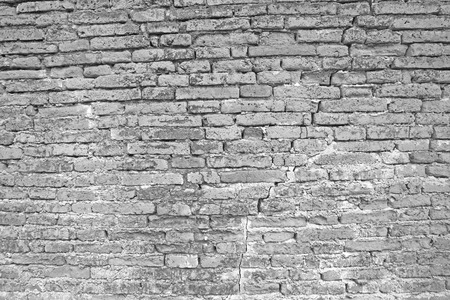 Cracked white brick wall backgroundの写真素材