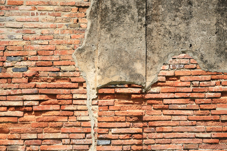 Cracked concrete and grunge red brick wallの写真素材