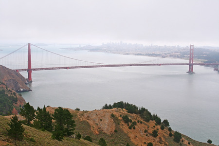 famous Golden Gate Bridge with mist in San Francisco, USAの写真素材