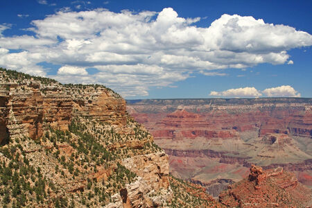 Grand Canyon on sunny day against white cloud and blue sky in Arizona, USAの写真素材