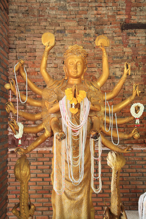Golden Guanyin with Thousand Arms at wat Salaloi in Korat or Nakhon Ratchasima, Thailandの写真素材