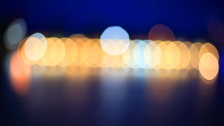 Abstract colorful circular bokeh with blue backgroundの写真素材