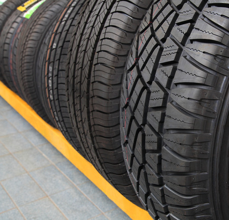 Group of new tires for sale at a tire storeの写真素材