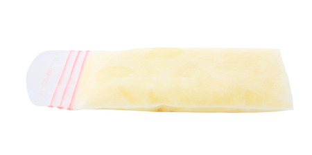 frozen breastmilk in bag isolated on white backgroundの写真素材