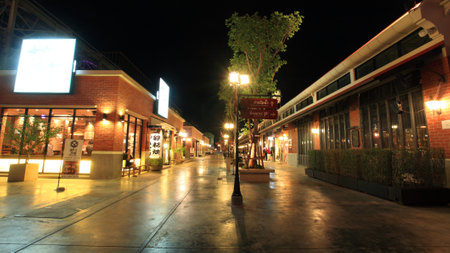 BANGKOK-JULY 07, 2012: Asiatique The Riverfront with vivid light at night. Three are more than 500 outdoor shopping stores in Asiatique The Riverfront.のeditorial素材