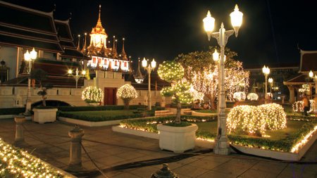 Wat Ratchanadda with light decoration at the park in front of the temple, Bangkok, Thailandのeditorial素材