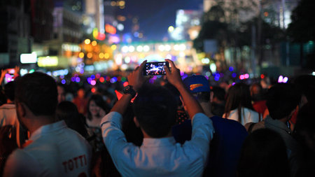 BANGKOK, THAILAND - December 31, 2014: Unidentified man use smartphone to capture countdown happy new year 2015 at central world shopping center.のeditorial素材
