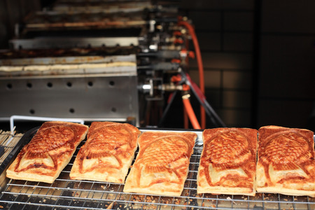 taiyaki, japanese fish shaped cakes filled with red beanの写真素材