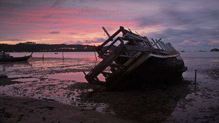 shipwreck at dawn with twilight sky in Phuket, Thailandの写真素材