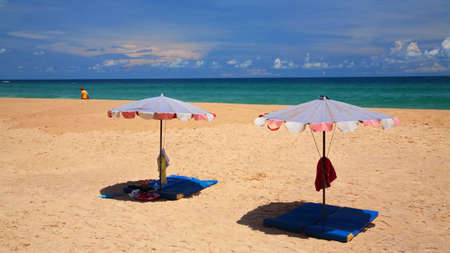 Parasols on sand at Karon beach in Phuket, Thailandの写真素材