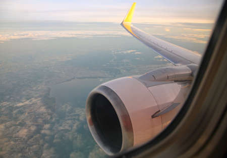 View through airplane window at low altitudeの写真素材