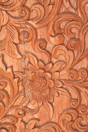 Pattern of Thai floral sculpture on wood backgroundの写真素材