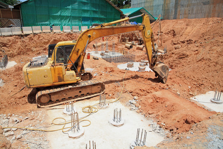 Excavator machine with bucket on construction siteの写真素材