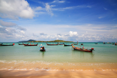 Thai Longtail fisherman boat on Andaman sea at rawai beach, Phuket Thailandのeditorial素材