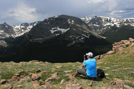 Photographer shooting picture at the viewpoint of Rocky mountain in Colorado, USAの写真素材