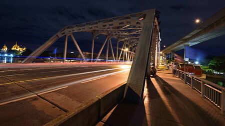 Light trail on Krungthep Bascule bridge at dusk in Bangkok, Thailandの写真素材